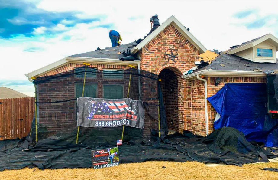 Roofers replacing roof in Keller with American national roofing