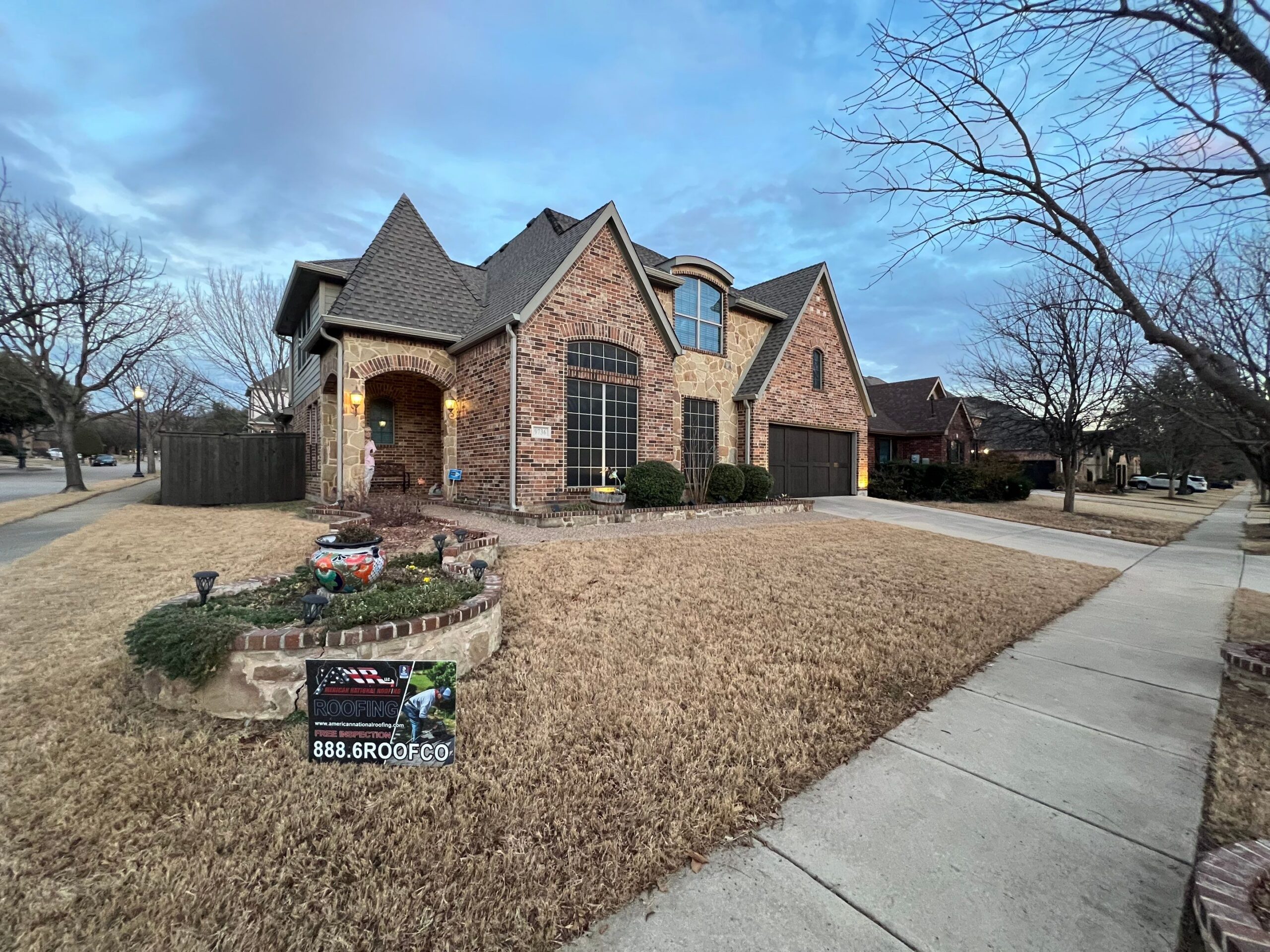 New roof installed by American National Roofing on a Keller, TX home with our company yard sign